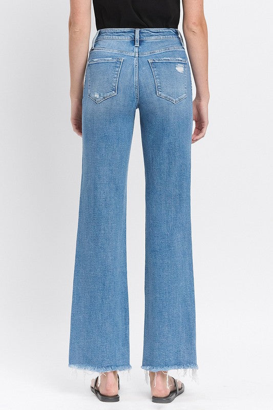 High Rise Medium Wash Distressed Slim Wide Leg Jeans